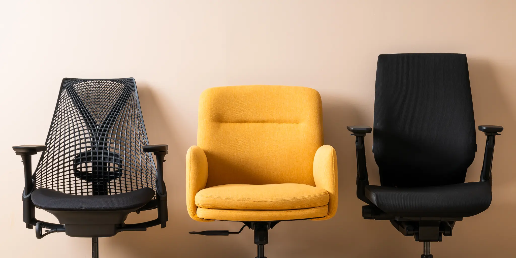 A shared workspace with ergonomic chairs and white desks